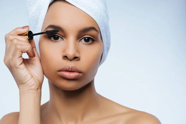 Pleasant cute woman using mascara — Stock Photo, Image