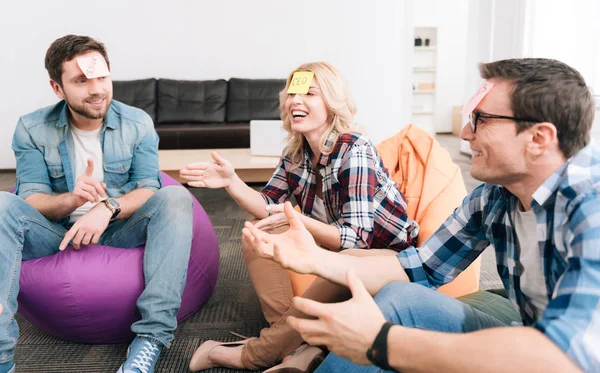 Positive optimistic colleagues entertaining themselves — Stock Photo, Image