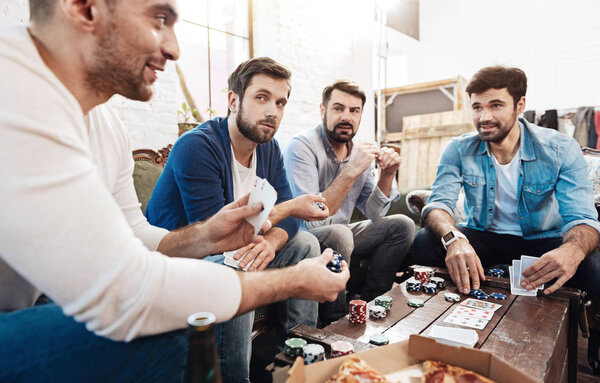 Handsome cheerful man making a bet