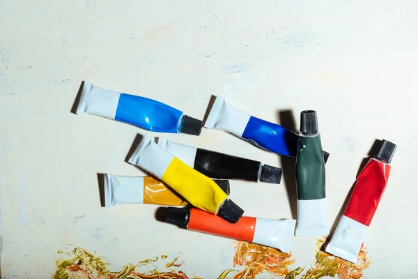 Close up of tubes with paint on white background — Stock Photo, Image