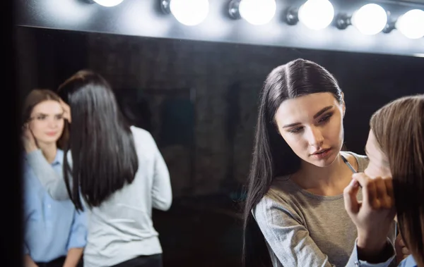 Nice cute makeup artist applying mascara — Stock Photo, Image