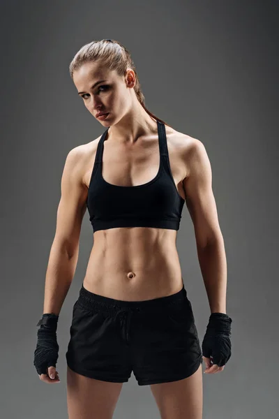 Strong girl posing with elastic sport bandage — Stock Photo, Image