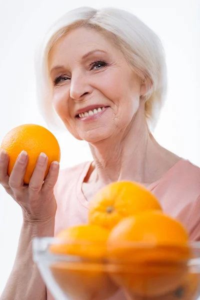 Close up of positive delighted woman posing at camera — Stock Photo, Image