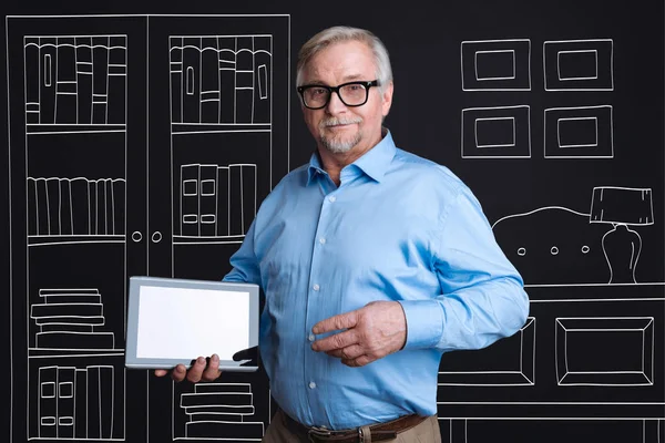 Confident intelligent man holding a tablet — Stock Photo, Image