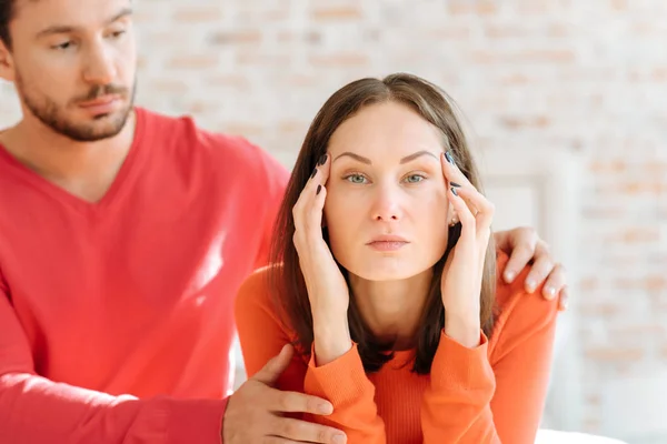 Mindful man taking care about his girlfriend at home — Stock Photo, Image