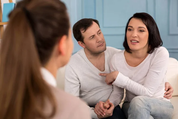 Attractive brunette woman pointing at her husband — Stock Photo, Image