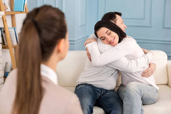 Joyful cheerful couple hugging each other — Stock Photo, Image