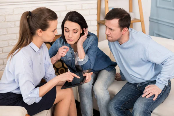 Nice family psychologist holding a tablet — Stock Photo, Image