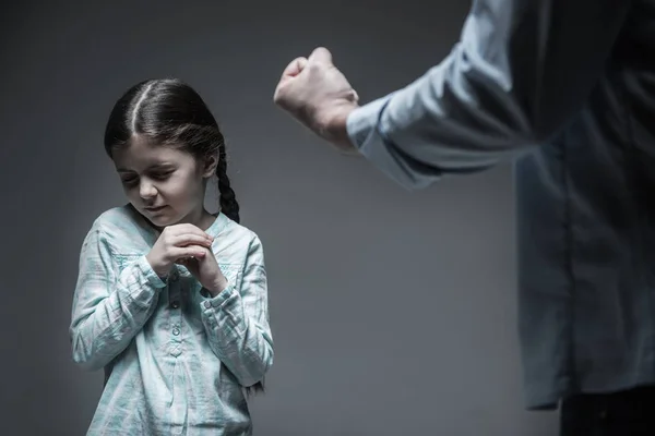 Close up of male fist while made to hit his daughter — Stock Photo, Image