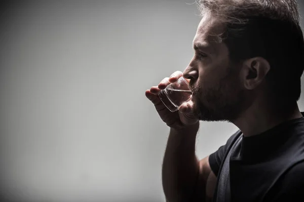 Profilo di serious beard man while drinking beverage — Foto Stock