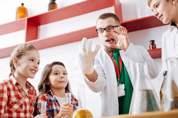 Man entertaining children