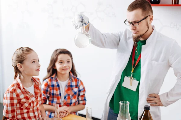 Man holding chemical flask — Stock Photo, Image