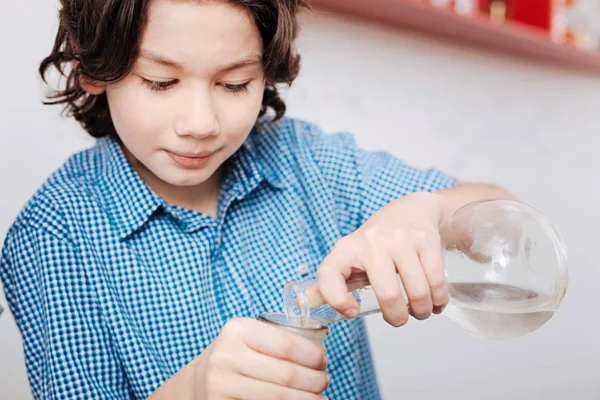 Boy holding flasks — Stock Photo, Image