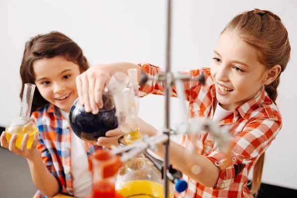 Girls enjoying chemistry lesson — Stock Photo, Image