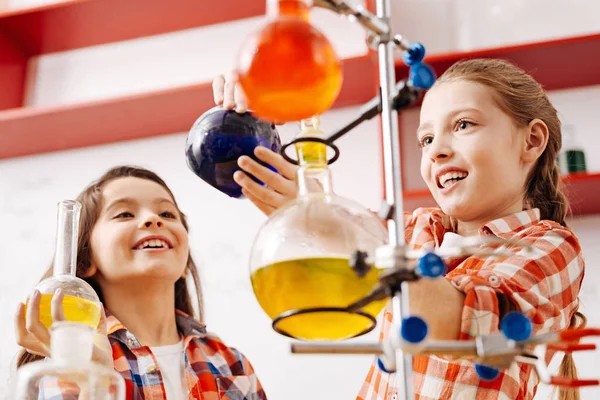 Girls using scientific equipment — Stock Photo, Image