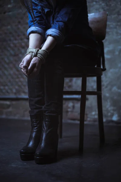 Young victim sitting on chair — Stock Photo, Image