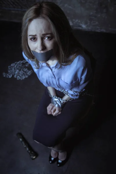 Girl sitting on chair tied up — Stock Photo, Image