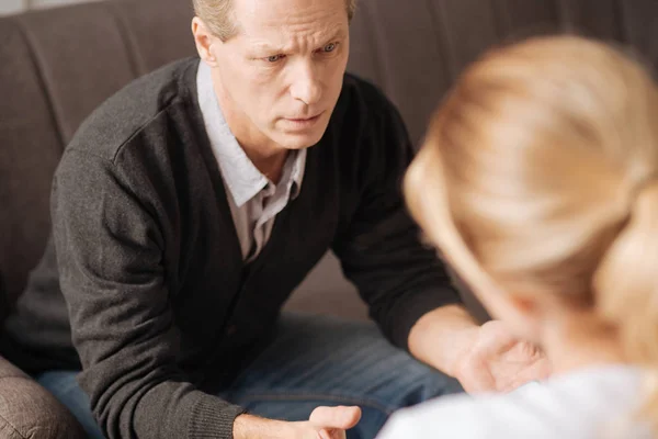 Man sitting on sofa and thinking — Stock Photo, Image