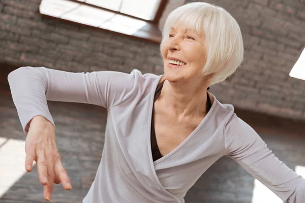 Aged woman performing in ballroom — Stock Photo, Image