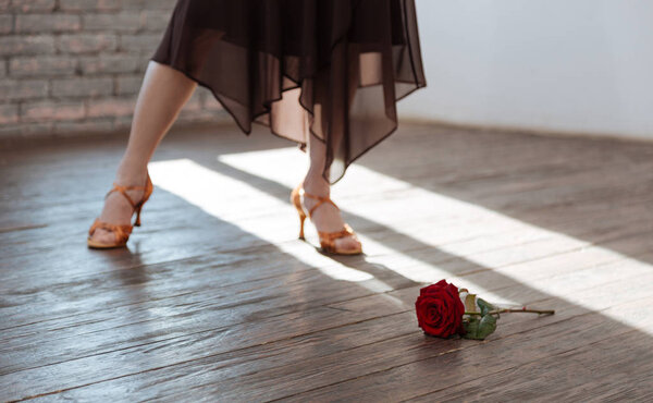 Gifted woman dancing tango at the ballroom