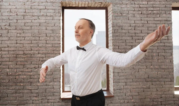 Optimistic bearded aged man enjoying classical dance at the ballroom — Stock Photo, Image