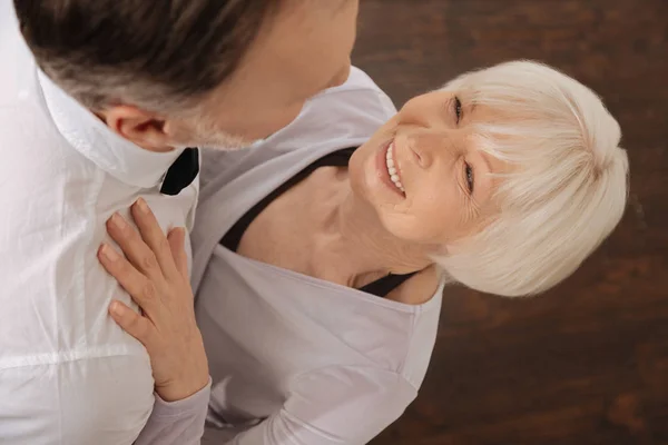 Delighted pensioners enjoying waltz in the dance studio — Stock Photo, Image