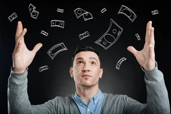 Successful man enjoying money rain — Stock Photo, Image