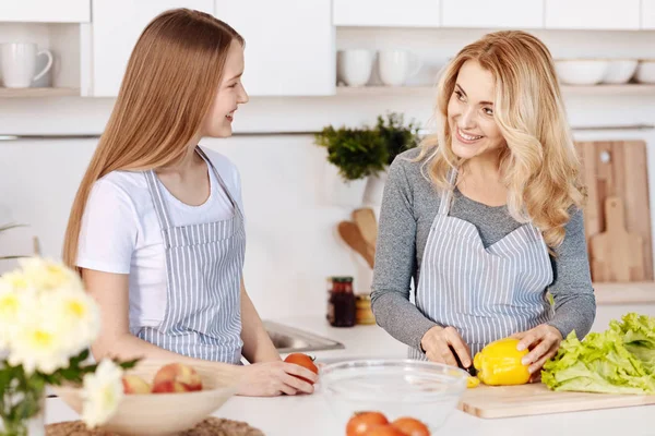 Cheerful mother and daughter cooking in the kitchen — Stock Photo, Image