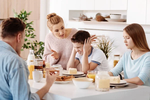 Emotional parents yelling at their son — Stock Photo, Image