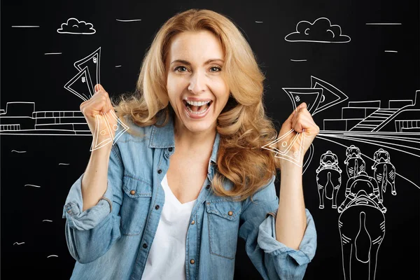 Happy blonde woman winning money — Stock Photo, Image