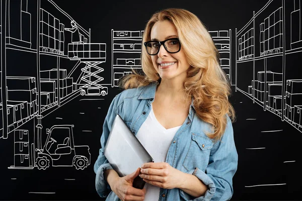 Pleasant intelligent woman working at the post office — Stock Photo, Image