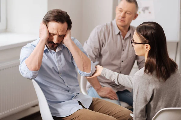 Stubborn man putting hands on his ears — Stock Photo, Image