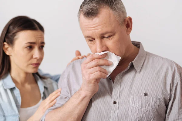 Portrait of sad man keeping serviette near mouth — Stok Foto