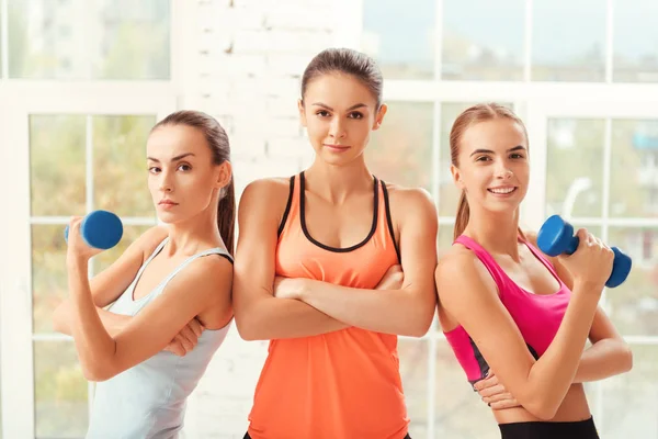 Group of ladies posing with dumbbells — Stock Photo, Image