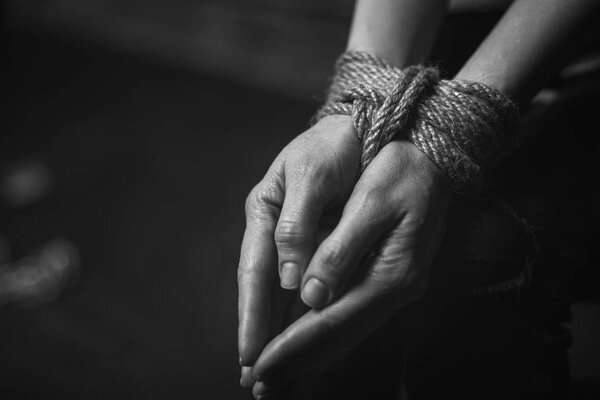 Young scared lady corded up