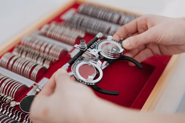 Eye examination glasses being taken out of the box — Stock Photo, Image