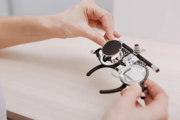 Eye test spectacles being held by an optician — Stock Photo, Image