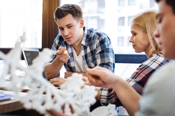 Smart student discussing DNA model — Stock Photo, Image