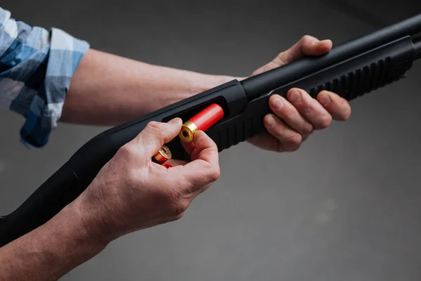 Close up of a bullet being put into the rifle — Stock Photo, Image