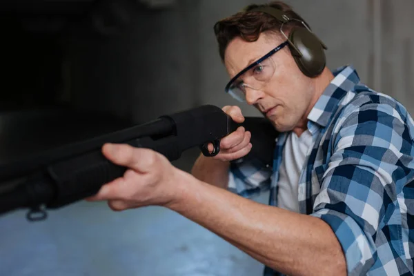 Confident skilled marksman concentrating on the activity — Stock Photo, Image