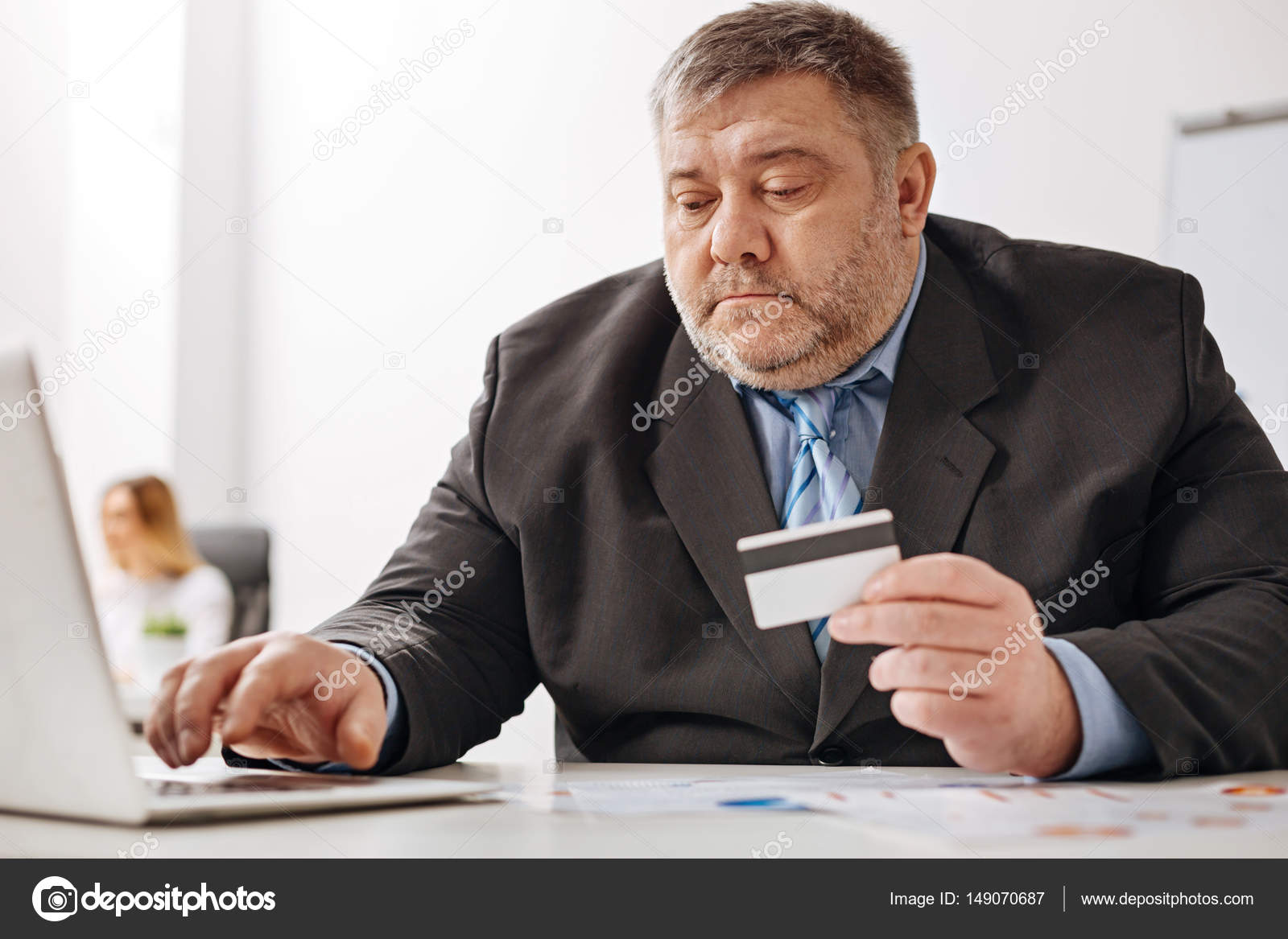 Chubby office worker buying things online Stock Photo by ©yacobchuk1  149070687