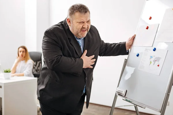 Worker feeling extreme pain in chest — Stock Photo, Image