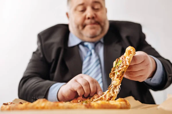 Chubby white collar worker enjoying his midday meal — Stock Photo, Image