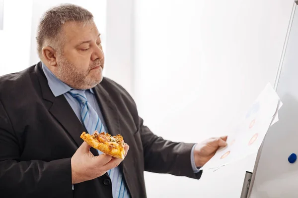 Busy competent worker having no time for lunch — Stock Photo, Image