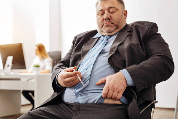 Overweight office worker having health issues
