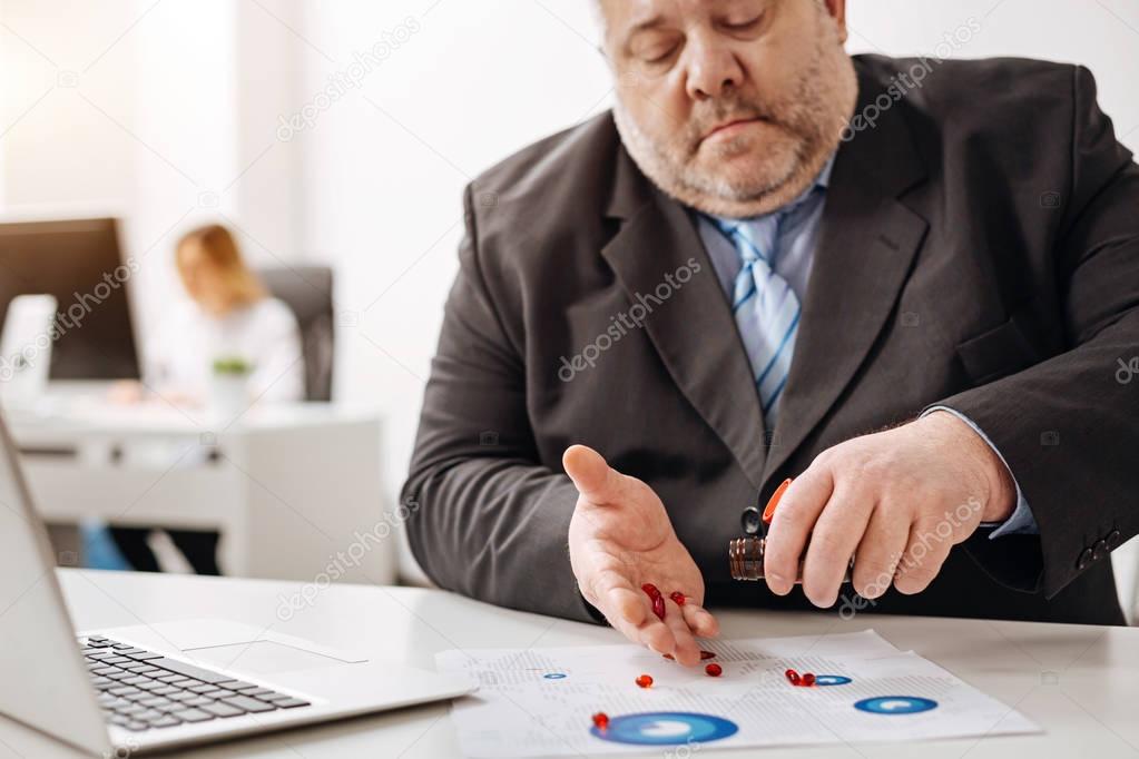 Unwell stressed worker getting his treatment