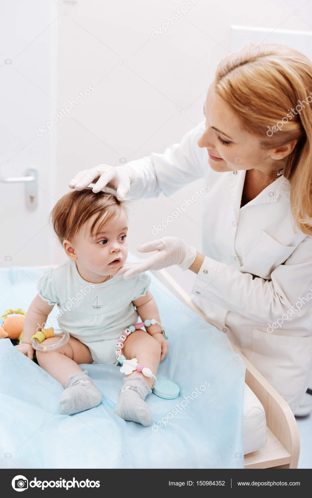 Female pediatrician examining child Stock Photo by ©yacobchuk1 150984352
