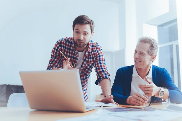 Pleasant involved colleagues workign on the project — Stock Photo, Image