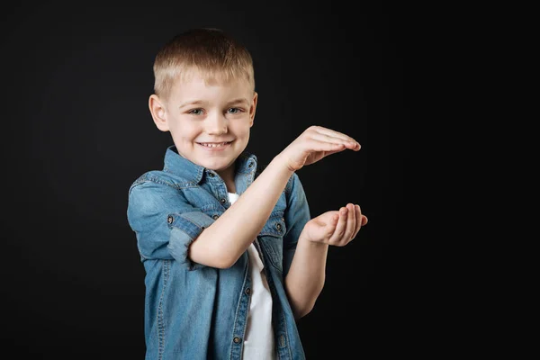 Amusing man child keeping his hands in the air — Stock Photo, Image