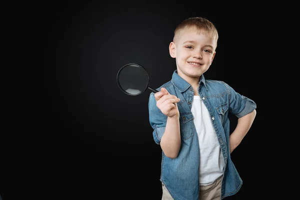 Positive delighted kid putting his left hand on the belt — Stock Photo, Image